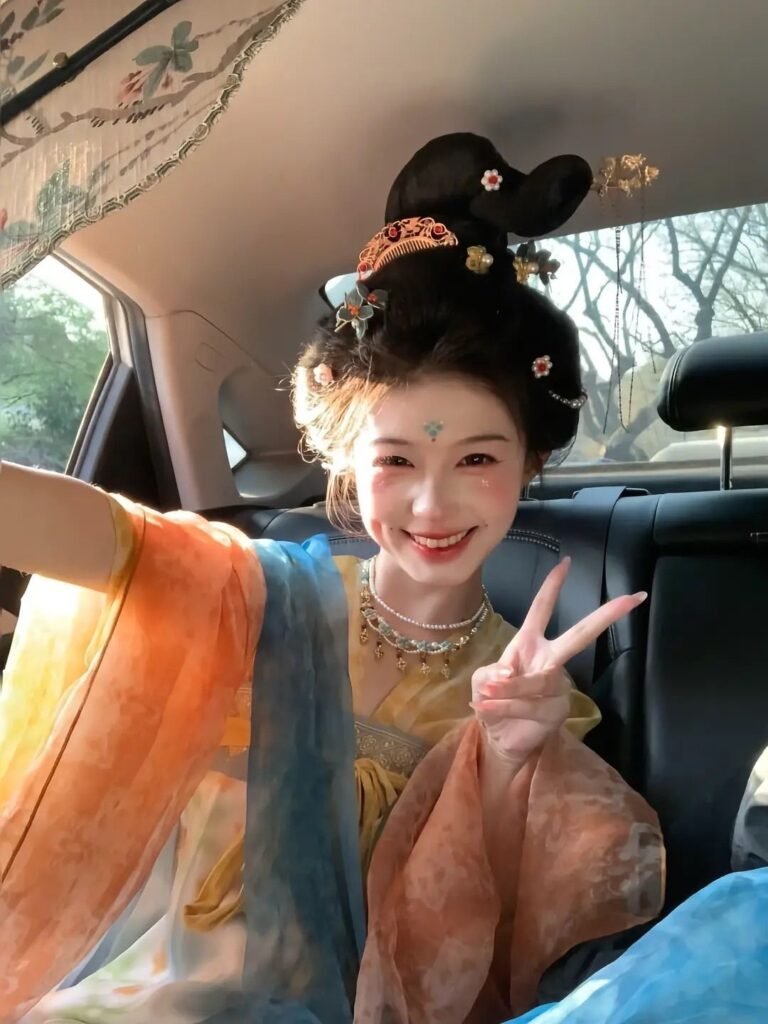 Young lady wearing Moon Laurel restored Tang Dynasty Qixiong Ruqun hanfu set, yellow chiffon hanfu with blue shawl holding pipa by lake
