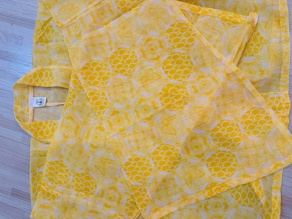 Young lady wearing Moon Laurel restored Tang Dynasty Qixiong Ruqun hanfu set, yellow chiffon hanfu with blue shawl holding pipa by lake